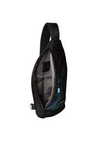 Mochila de bandolera negra con correa acolchada, acentos en azul con puntos, cremallera abierta que revela bolsillos interiores grises y pequeña etiqueta negra en el interior.