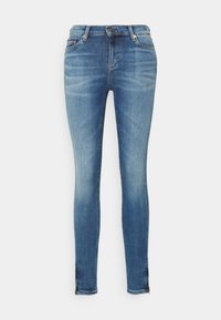 Skinny-fit blue denim jeans with a faded wash. Features a classic five-pocket design, zipper fly, and subtle stitching details.