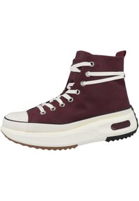 Maroon high-top sneaker with white laces, rubber toe cap, and a thick white sole. Features a textured upper and branding on the back.