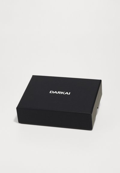 Black rectangular box with a smooth matte finish. Features the white text "DARKAI" centered on the top surface. Minimalistic design.