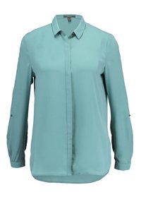 Blouse à manches longues couleur sarcelle avec boutons avant cachés, col classique, et pattes boutonnées sur les manches pour les retrousser.