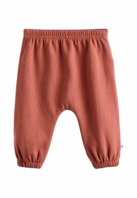 Weiche rostfarbene Babyhosen mit elastischem Bund und Bündchen, flach auf weißem Hintergrund präsentiert.