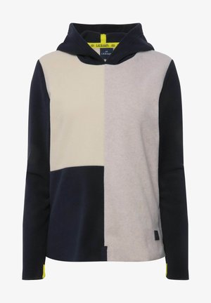 Hooded sweatshirt featuring a patchwork design in navy, cream, and gray, made of soft fleece material with a tag detail on the hem.