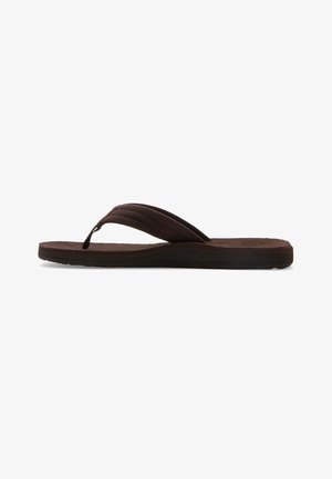Brown flip-flop sandal with a textured suede strap and a flat rubber sole. The design features a minimalistic profile and a thong style.