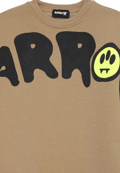 Felpa beige con grandi lettere nere a bolle che scrivono "BARO." Presenta una grafica di un fantasma verde con denti aguzzi, design con collo a giro e texture morbida.