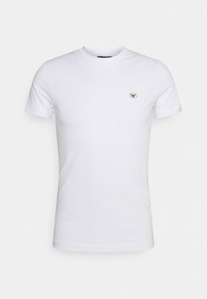 White cotton t-shirt with a crew neckline, short sleeves, and a small hexagonal logo on the chest. Smooth texture, simple design.