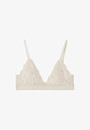 Spitzen-Bralette in hellnude mit floralem Muster, verstellbaren Trägern und einem elastischen Band mit Logo. Weiche Textur insgesamt.