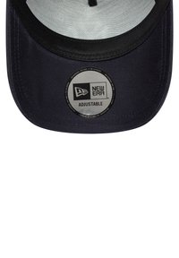 Adjustable navy cap with a structured crown, black brim, and reflective New Era logo patch at the front. Interior features a mesh lining.