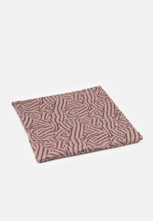 Pink fabric square with abstract dark brown irregular stripe pattern laid flat on a white surface.