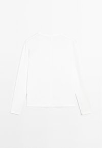 Long-sleeve white top made of smooth fabric, featuring a round neckline and a straight cut, with simple design and no visible patterns or accents.