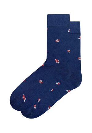Marineblaue Socken mit geripptem Bündchen, verziert mit einem wiederholten Muster aus roten und weißen Pilzmotiven auf glatter Oberfläche.