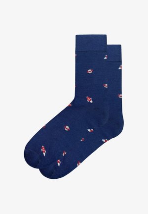 Calcetines azul marino con puño acanalado, que presentan un patrón repetido de motivos de hongos rojos y blancos sobre una textura lisa.