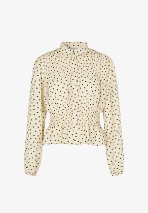 Kreemipaneel mustade täppidega, pikad varrukad, nööpidega esiosa ja mässitud vöödetail. Pehme kangas, lõdva istumisega.