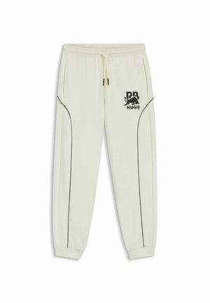 Pantalones jogger blancos con ribete negro, puños elásticos, cintura con cordón, bolsillos laterales y un logo negro de RB HUGO en el muslo izquierdo.