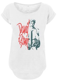 White T-shirt with rolled sleeves featuring a graphic print of a figure in a suit. Text reads "David Bowie" in red, bold letters.