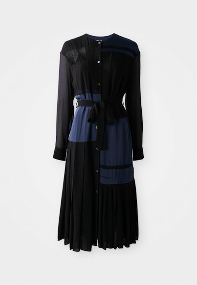 Black and navy dress with a button-down front, long sleeves, waist tie, layered panels, and a pleated skirt. Features lace accents.