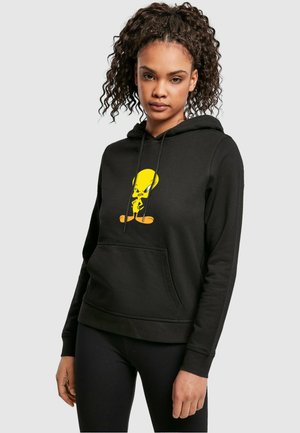 Black hoodie featuring a front kangaroo pocket and a vibrant yellow Tweety Bird graphic on the chest. Soft fabric with a relaxed fit.