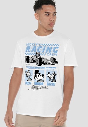 Man wearing white t-shirt featuring Mickey Mouse driving race car with Daisy, Mickey, and Goofy cartoon faces below and racing-themed text.