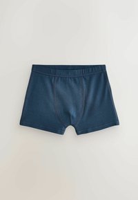Boxers pour hommes bleu foncé avec des coutures visibles, ceinture élastique et coupe près du corps, posés à plat sur un fond clair.