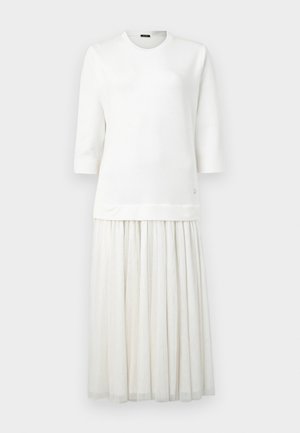 White dress with a fitted top and a flared, pleated skirt. Made from soft fabric with a round neckline and three-quarter sleeves.