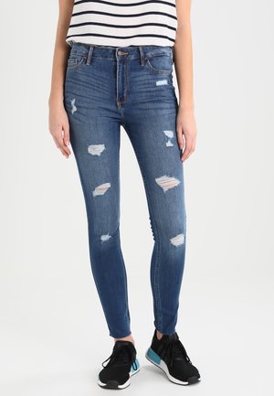 Vaqueros pitillo - destroyed denim