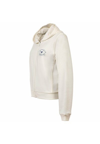 Kremowa bluza z kapturem na zamek z logo Emporio Armani na piersi, długimi rękawami oraz ściągaczami na mankietach i dole.