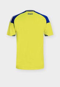 Yellow sports jersey with blue accents on shoulders, white stripes down sleeves, and "SVERIGE" logo at the back neckline. Short-sleeved design.