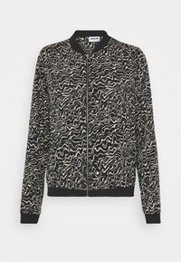 Černá bomber bunda s abstraktním krémovým vzorem, žebrovaným límcem a manžetami, zipovým zapínáním a volným střihem.