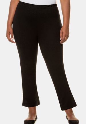 Pantaloni neri elasticizzati con design a gamba svasata, dotati di una vita elasticizzata e una superficie liscia, adatti per un abbigliamento casual.
