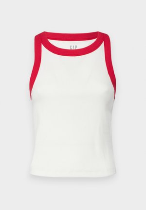 Fehér bordázott ujjatlan trikó piros díszítéssel a nyakán és a karöltőin. Feszes fazon, egyenes alj. Texturált anyag. Márka logója látható.