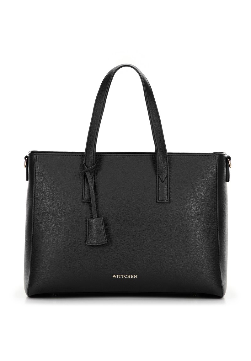 Schwarze Leder-Tote mit strukturierter Oberfläche, zwei Griffen, goldener Schriftzug "WITTCHEN" am Boden und einem hängenden Etikett.