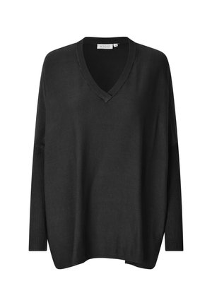 Pull oversized noir avec un col en V, des manches longues, des poignets côtelés et une coupe décontractée. Texture lisse et design minimal.