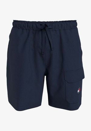 Marina simbyxor med elastisk midja och justerbar dragsko. Har en sidoficka i cargo-stil och en liten logopatch på fållen.