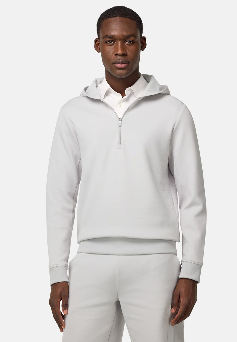 Lichtgrijze pullover sweatshirt met een capuchon en een kwart-ritssluiting. Voorzien van geribde manchetten en een zoom, gemaakt van zachte, gestructureerde stof.