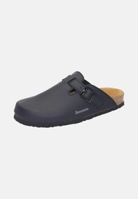 Black clogs made of matte synthetic material, featuring a buckle strap, open back, and cork footbed. Textured rubber sole for grip.