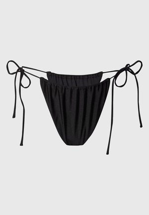 Black bikini bottom with adjustable side ties. Soft fabric, gathered design, and a solid color with no patterns. Lined interior visible.