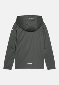 Veste à capuche gris foncé avec une texture lisse, des poignets élastiques et des détails de logo. Présente un design simple et un matériau léger.