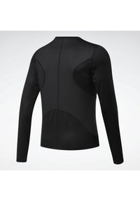 Långärmad svart träningsskjorta gjord av slät, elastisk tyg. Har en strukturerad baksida med böjda detaljer för passform och stöd.