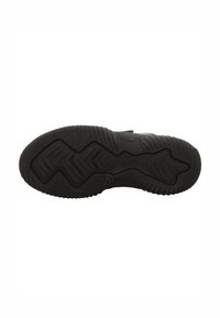 Suola in gomma nera con modelli di grip testurizzati e la parola "Superfit" impressa vicino all'area del tallone.