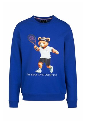 Blaues Sweatshirt mit einem Grafikdruck eines Bären, der Tennis spielt, mit weißen Akzenten, rundem Halsausschnitt und gerippten Bündchen. Der Text lautet "THE BEAR 19V69 COURT CLUB."