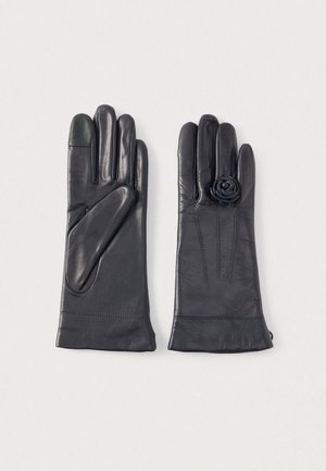 Læderhandsker i sort med en blomsterdekoration på den ene handske, tekstureret stof og en glat finish. Berøringsskærmskompatible fingerspidser.