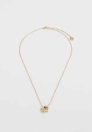 Kuldne kaelakee keeratud sõlme ripatsiga, millel on õrn kett ja reguleeritava pikkusega lukk. Sile ja läikiv tekstuur.