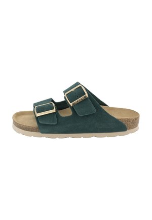 Green suede sandals with two adjustable straps, gold buckles, a cork footbed, and a light-colored, textured rubber sole.