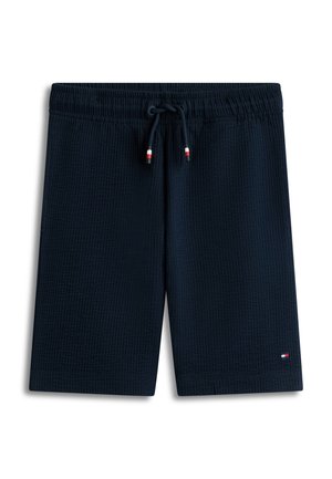 Marineblå teksturerede shorts med elastik i taljen og snøre, lille rød, hvid og blå logo nær kanten på højre ben.