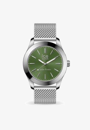 Green solar-powered watch with silver mesh band, round stainless steel case, and silver hour markers. Features a logo at the center.