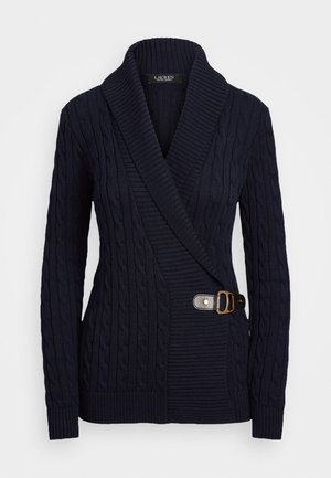 Navy knitted cardigan with a cable pattern, shawl collar, and a side buckle detail. Features ribbed cuffs and hem.