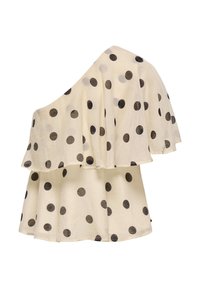 Blouse crème asymétrique à pois noirs avec un design à volants superposés sur fond blanc.