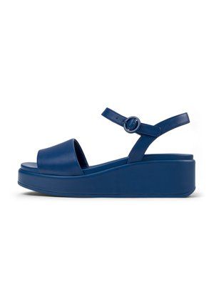 Sinised platvorm-sandaalid, millel on sile nahkviimistlus, avatud varvas, reguleeritav pahkluu rihm ja paks, tugev kiilkonts.