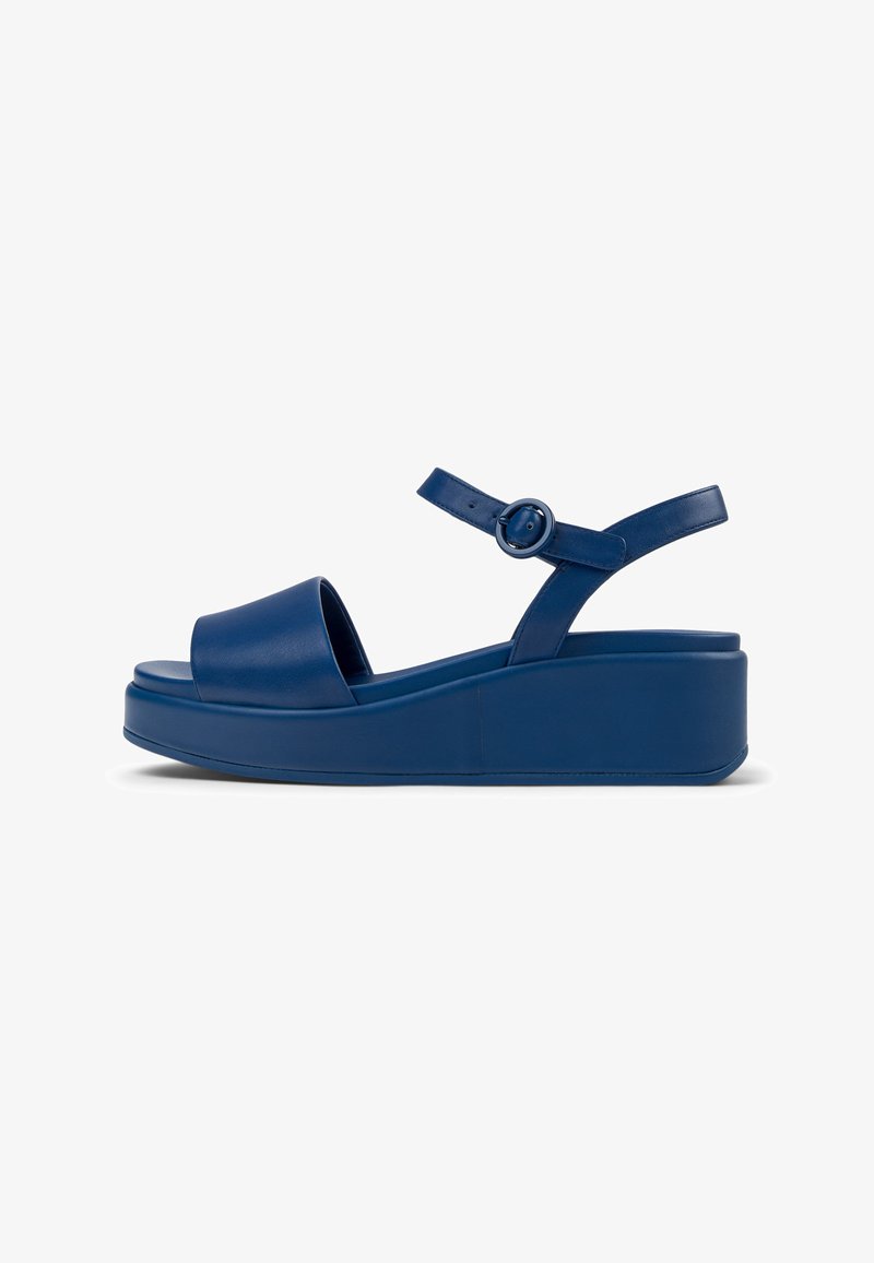 Blue platform sandals with a smooth leather finish, open toe, adjustable ankle strap, and a thick, solid wedge heel design.