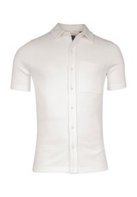 Witte polo met korte mouwen, gemaakt van getextileerd katoen, met een knoopsluiting aan de voorkant, een puntige kraag en een borstzak.